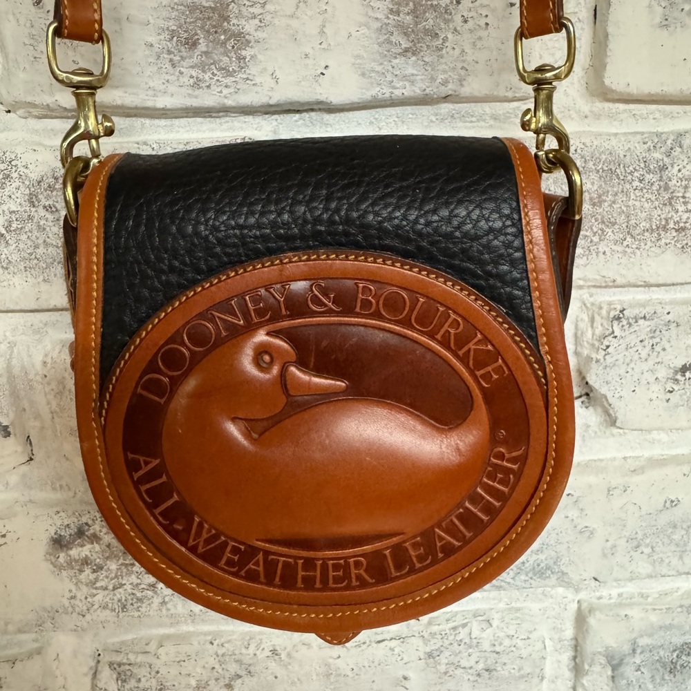 Dooney & Bourke Black and Tan Mini Crossbody with Large Medallion.